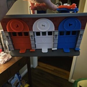 Melissa & Doug Colorful Garage Playset with Red, White, and Blue Doors